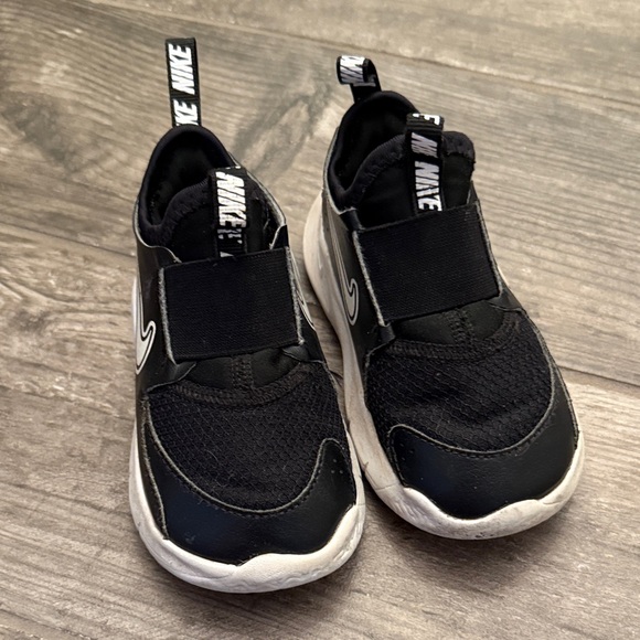 Nike Kids Black and White Slip-On Sneakers - Picture 1 of 5